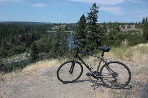 Bike parked on trail overlooking river