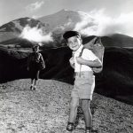 Vintage photograph of kids hiking with backpacks